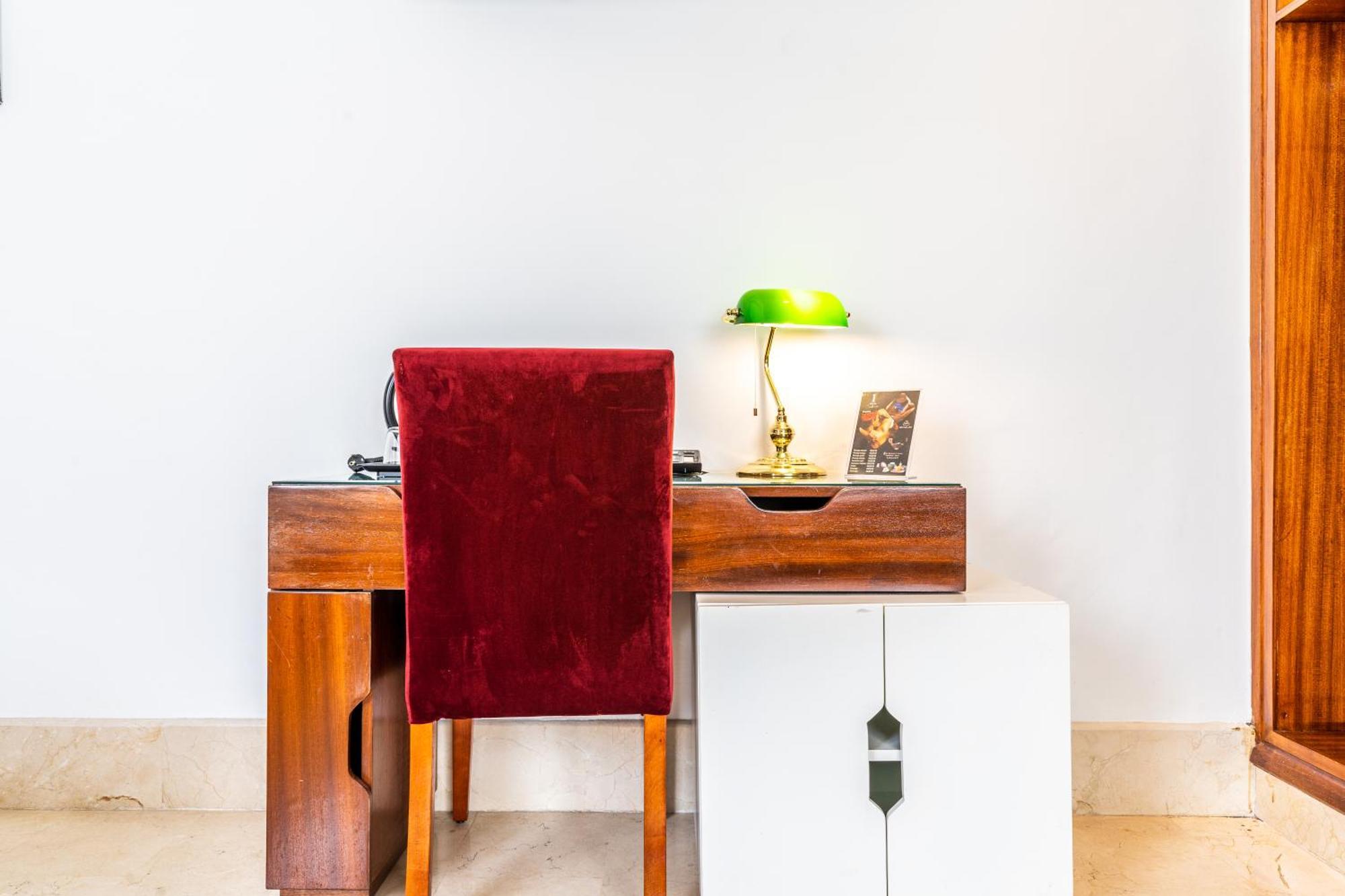 One Hotel Casablanca Exterior photo A desk with a green table lamp